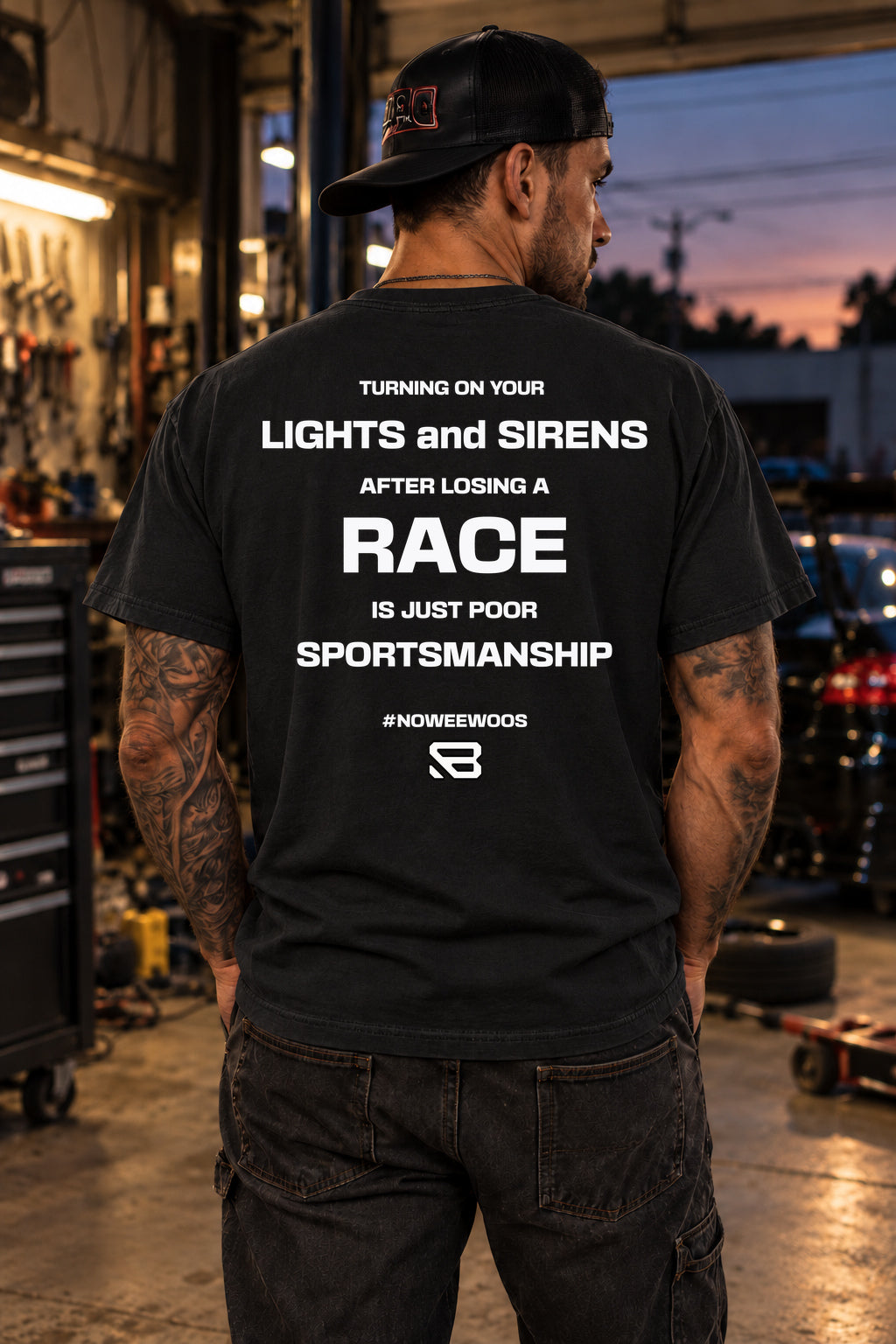 Male model showing the back of the black No Lights No Sirens Racing T-Shirt | Backlash HQ, original artwork