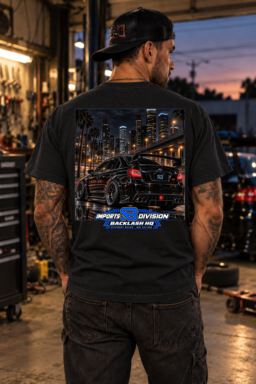 Male model showing the back of the black WRX STI Imports T-Shirt – Different Builds One Culture | Backlash HQ, original artwork