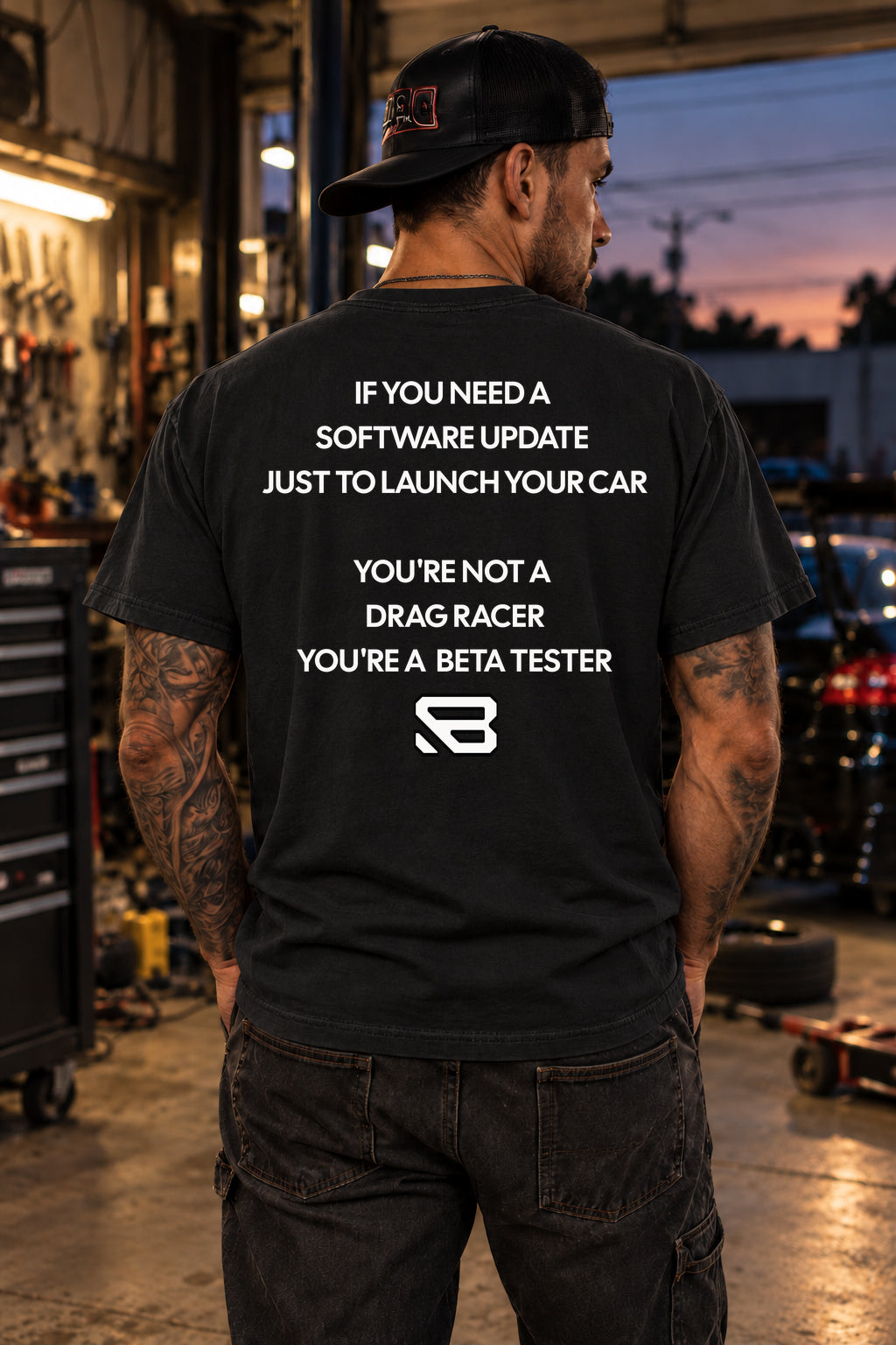 Male model showing the back of the black Software Update Beta Tester Drag Racing T-Shirt | Backlash HQ, original artwork
