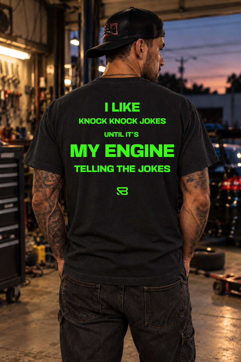 Male model showing the back of the black Knock Knock Engine Mechanic Humor T-Shirt | Backlash HQ, original artwork