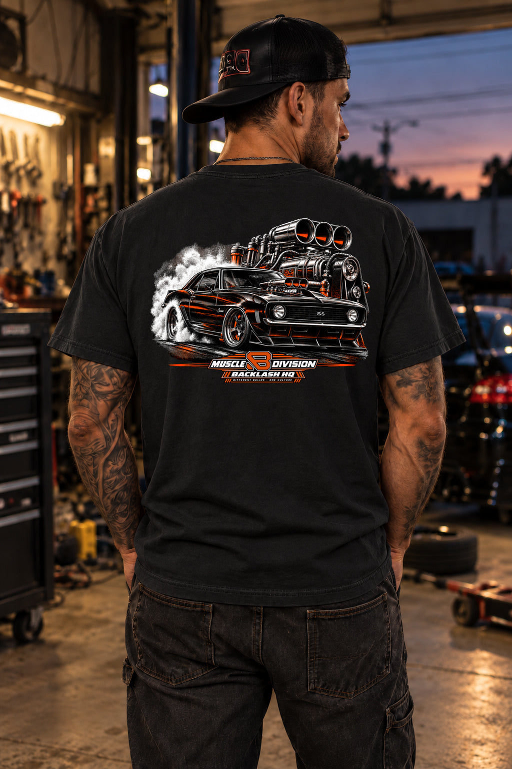 Male model showing the back of the black Built to Settle the Score Camaro Muscle Car T-Shirt | Backlash HQ, original artwork